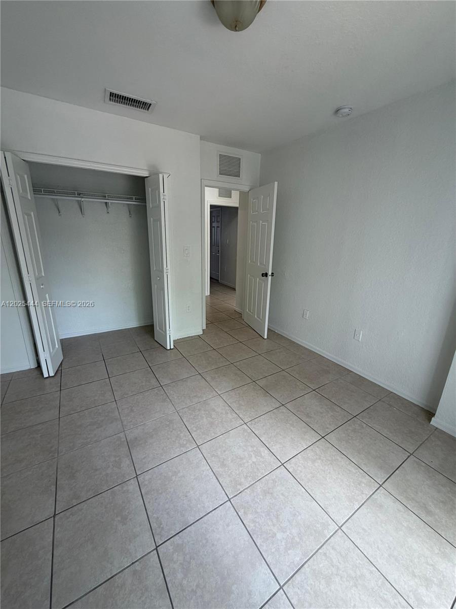 681 Southwest 7th Street, Unit 681 Florida City, FL 33034 - Photo 10 of 16 a view of an empty room and window