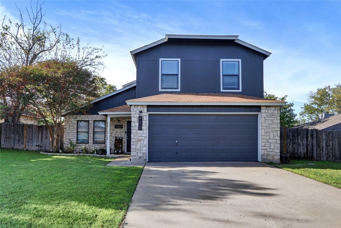 a house with a yard and garage