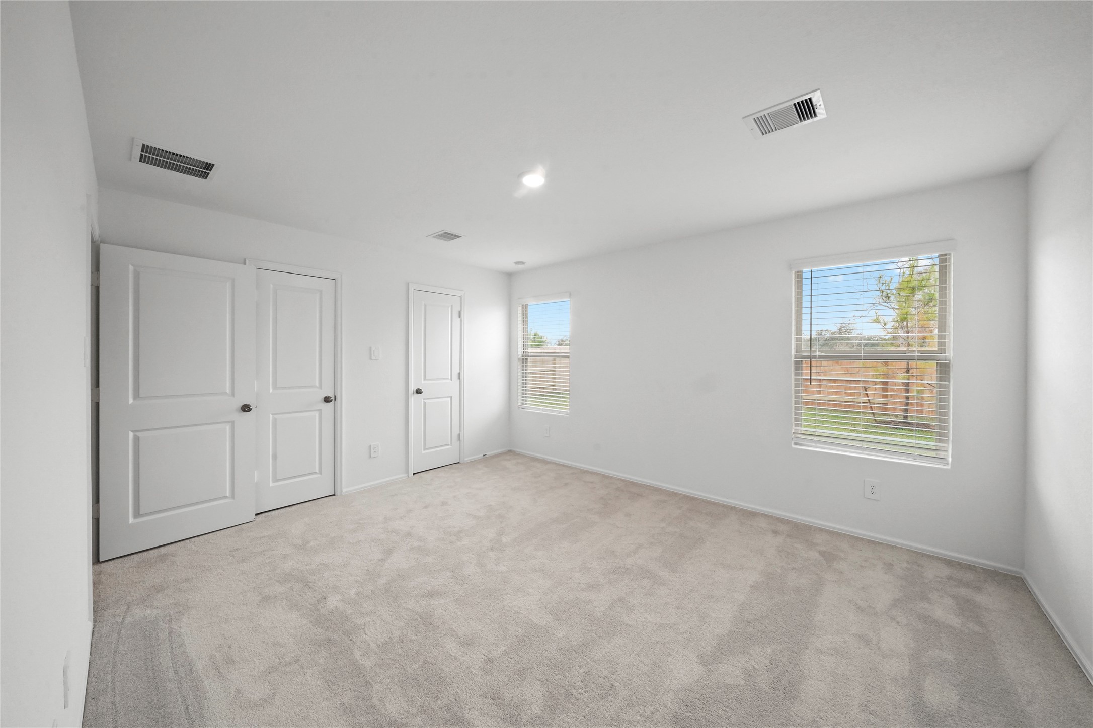 1440 Las Cuevas Drive Conroe, TX 77301 - Photo 18 of 25 a view of an empty room with a window