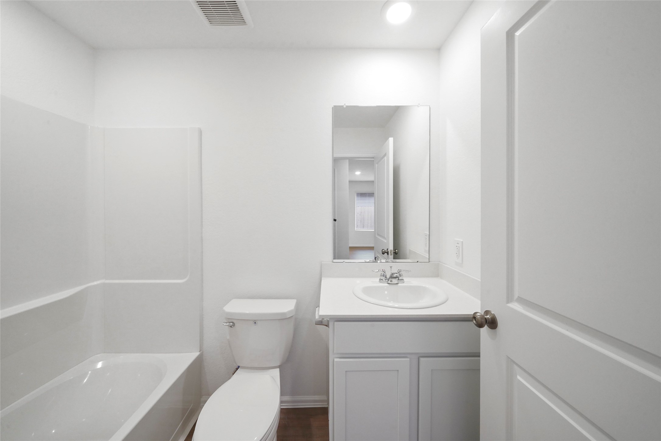 1440 Las Cuevas Drive Conroe, TX 77301 - Photo 19 of 25 a bathroom with a sink a toilet and shower