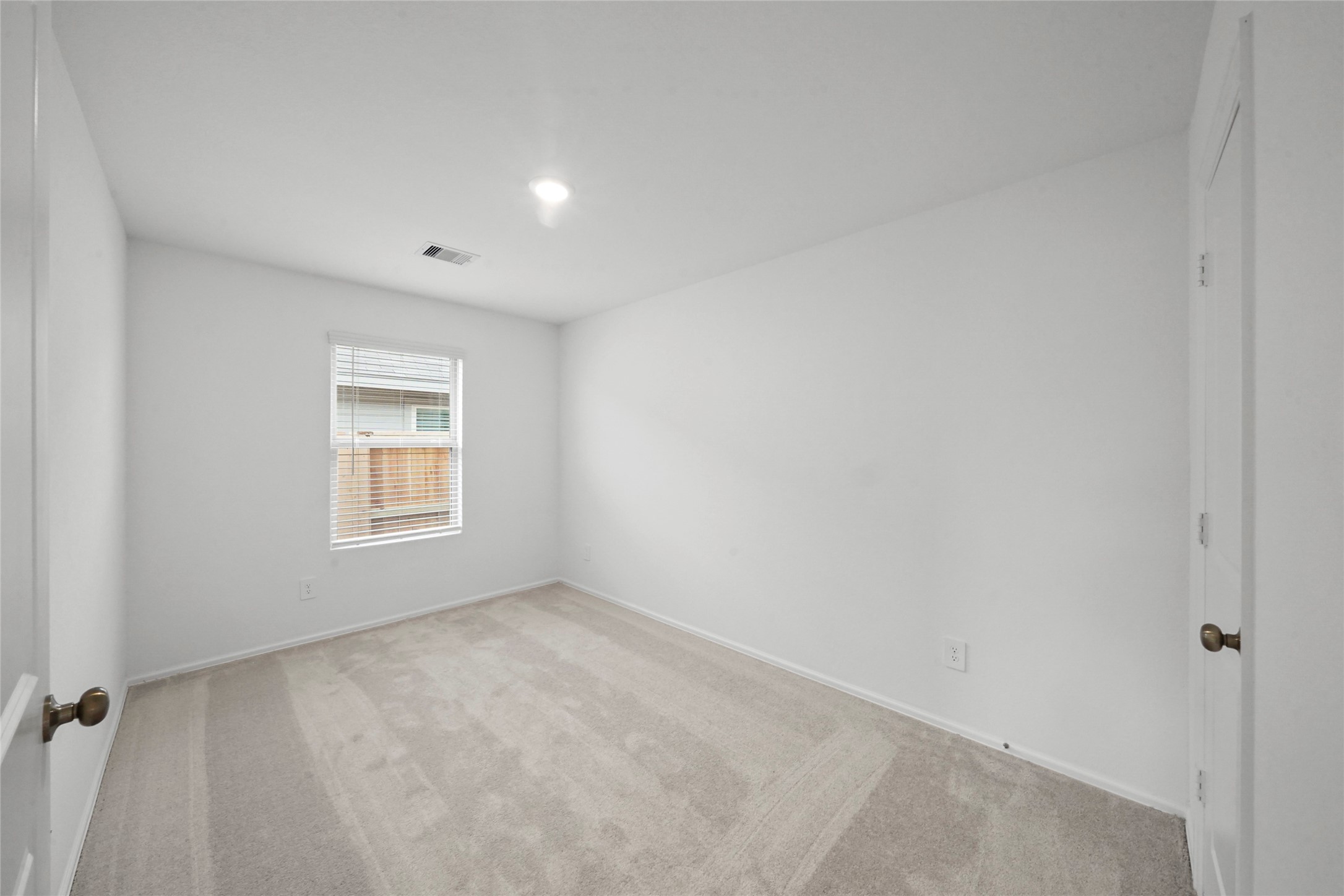 1440 Las Cuevas Drive Conroe, TX 77301 - Photo 21 of 25 an empty room with a window