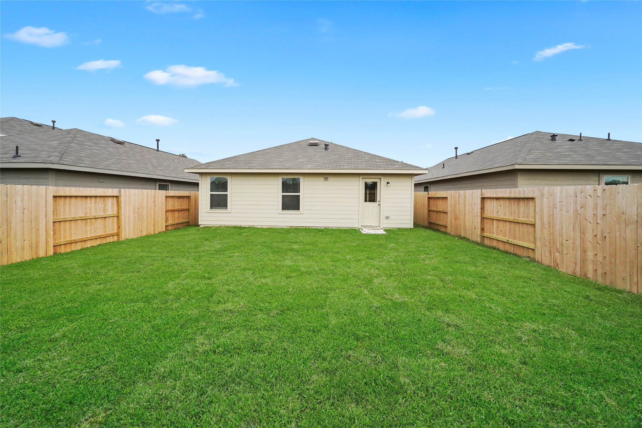 1440 Las Cuevas Drive Conroe, TX 77301 - Photo 24 of 25 a view of a house with a backyard