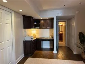 a bathroom with a sink and a large mirror
