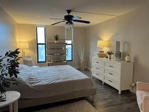 a bedroom with a bed and a dresser