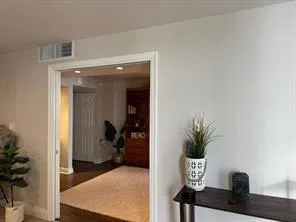 a view of living room with furniture and potted plant