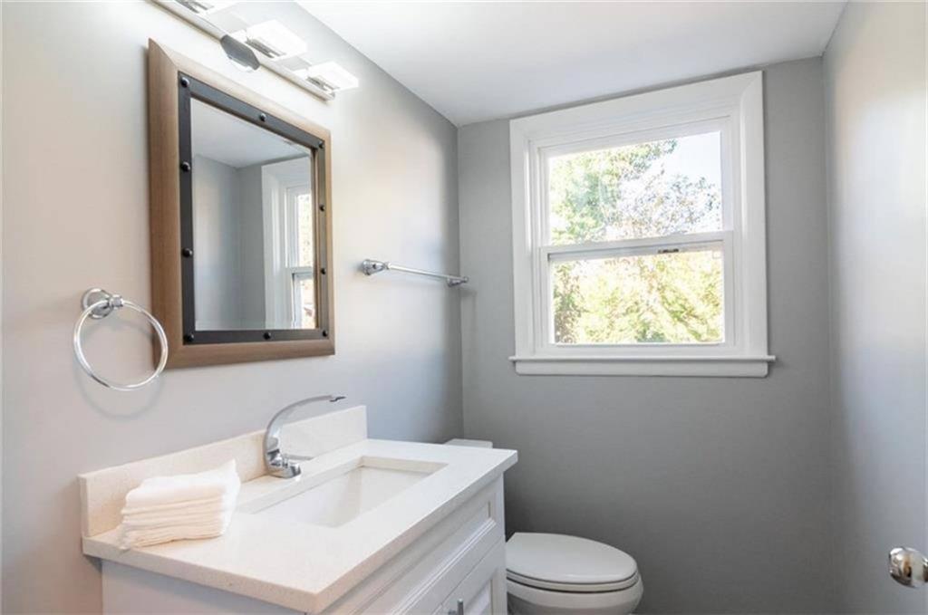 3022 Trafalgar Way, Unit 3022 Atlanta, GA 30341 - Photo 11 of 20 a bathroom with a sink toilet and mirror