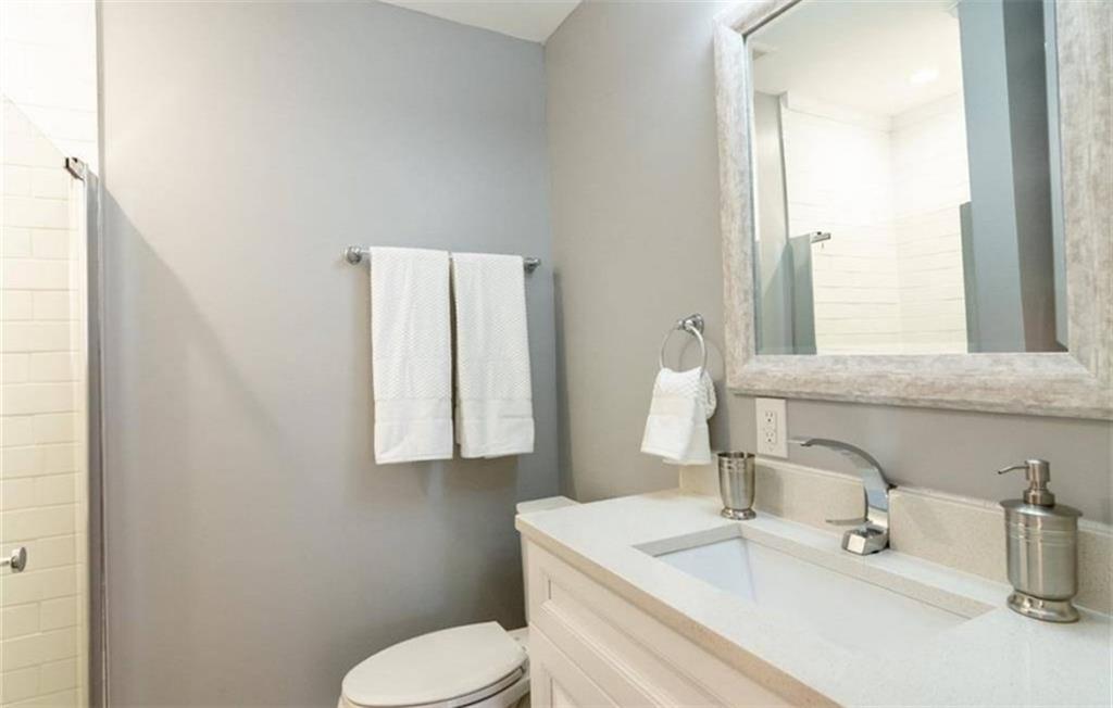 3022 Trafalgar Way, Unit 3022 Atlanta, GA 30341 - Photo 13 of 20 a bathroom with a sink and a mirror