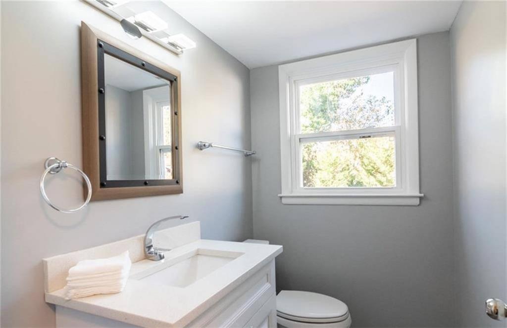 3022 Trafalgar Way, Unit 3022 Atlanta, GA 30341 - Photo 15 of 20 a bathroom with a toilet sink and mirror