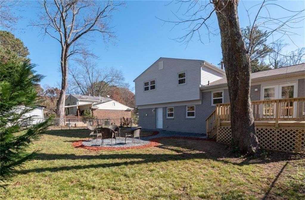 3022 Trafalgar Way, Unit 3022 Atlanta, GA 30341 - Photo 20 of 20 a front view of a house with a yard