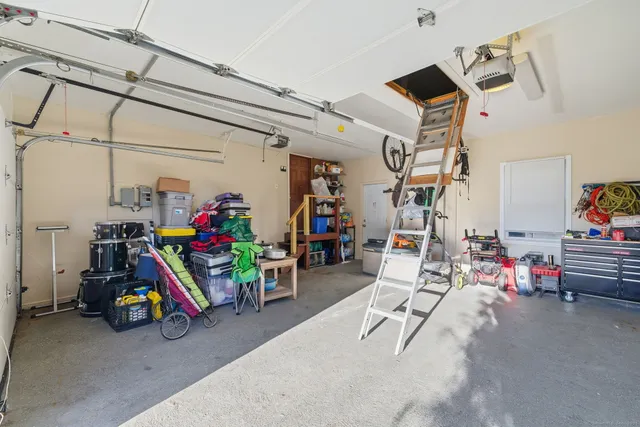 a view of a garage with rack and bicycle