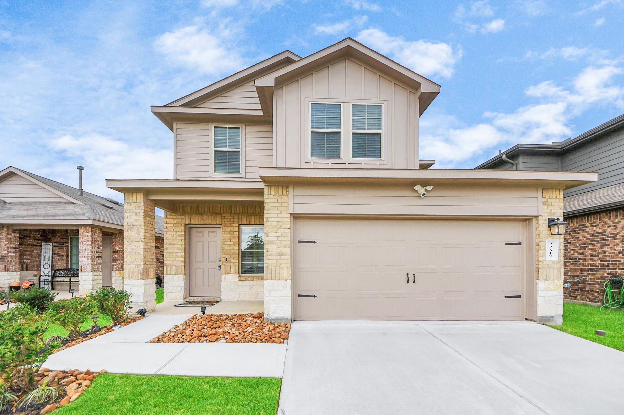 22619 Goose Pasture Lane Spring, TX 77373 - Photo 2 of 13 a front view of a house with a yard