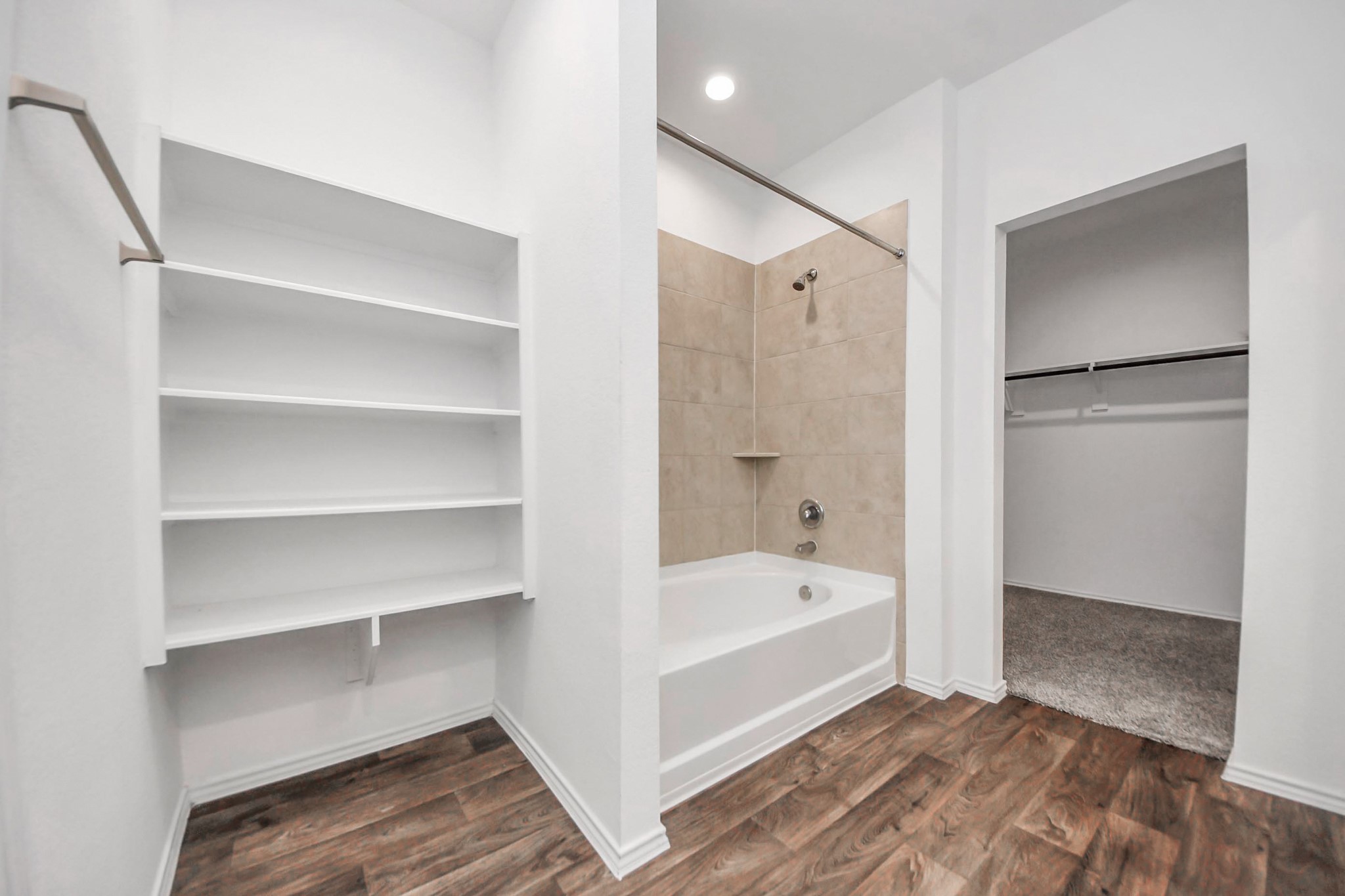 22619 Goose Pasture Lane Spring, TX 77373 - Photo 5 of 13 a bathroom with a tub shower and a sink