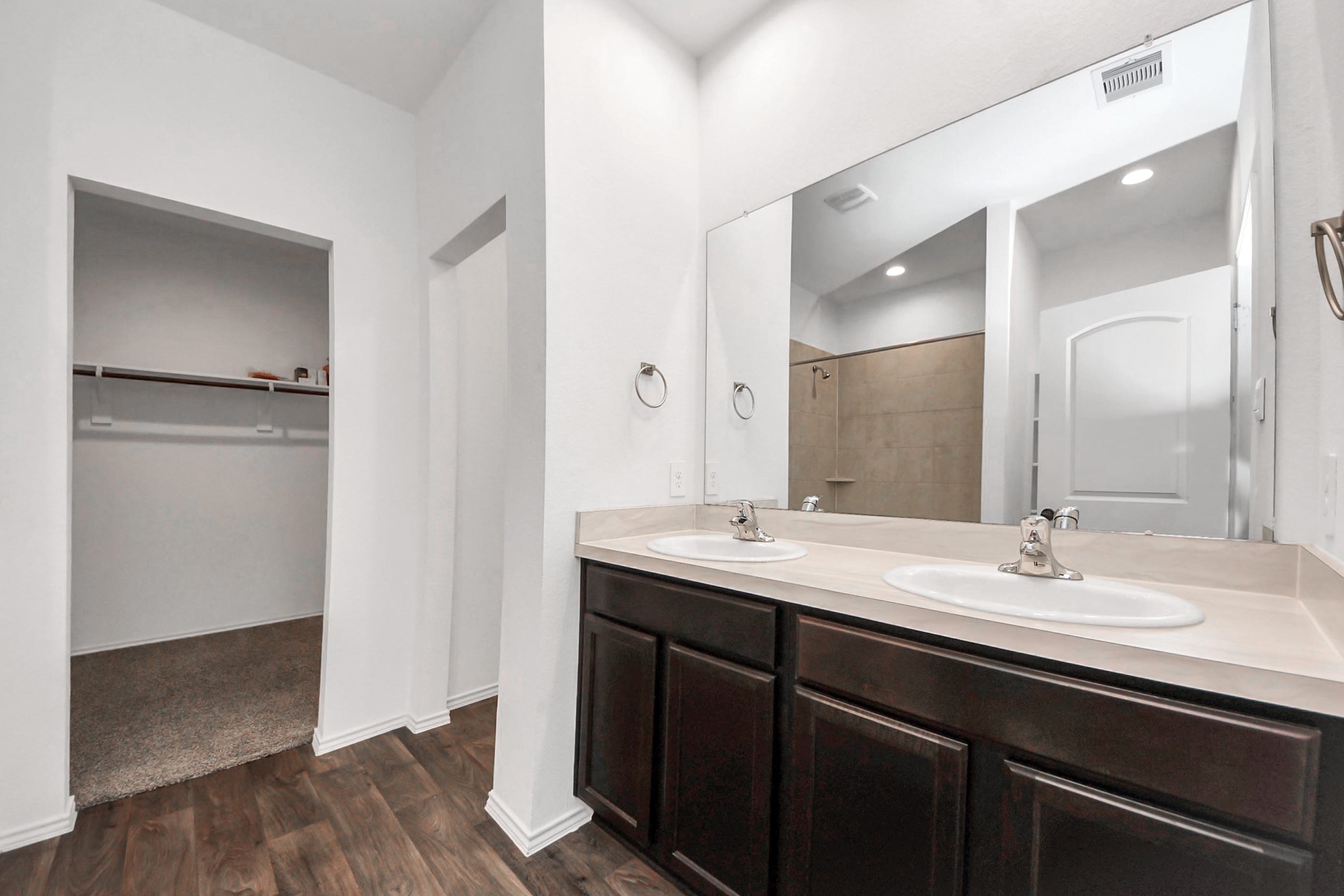 22619 Goose Pasture Lane Spring, TX 77373 - Photo 6 of 13 a bathroom with a double vanity sink and mirror