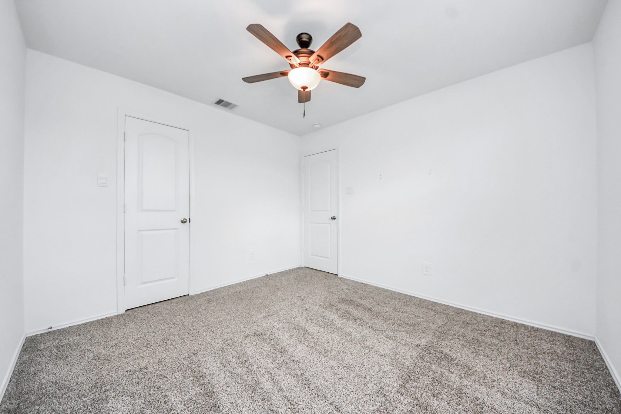 22619 Goose Pasture Lane Spring, TX 77373 - Photo 9 of 13 an empty room with ceiling fan