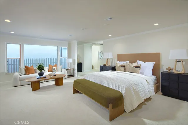 a spacious bedroom with bed and a large window