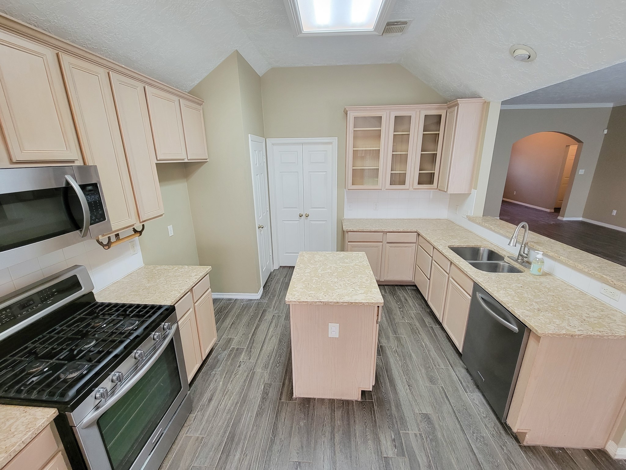 18511 Falcon Crest Drive Humble, TX 77346 - Photo 18 of 35 a kitchen with a sink stove and refrigerator