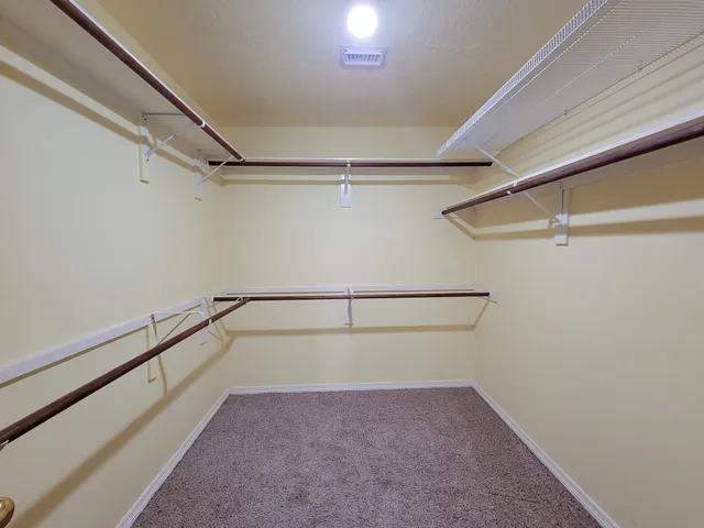 a spacious bathroom with a sink vanity and mirror