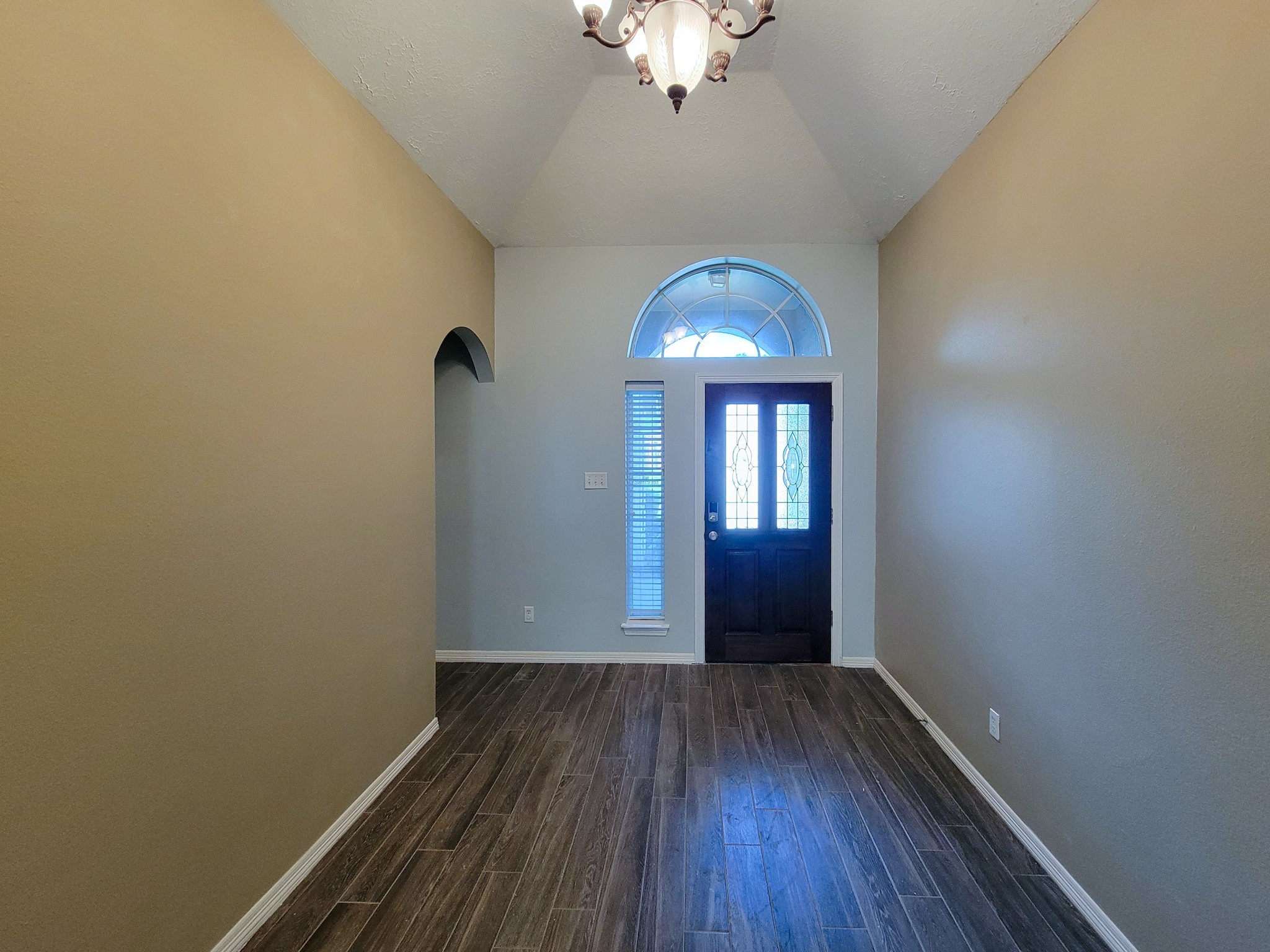 18511 Falcon Crest Drive Humble, TX 77346 - Photo 5 of 35 wooden floor in an empty room with a window