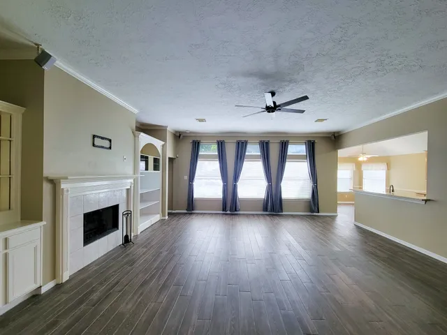 a view of hallway with wooden floor