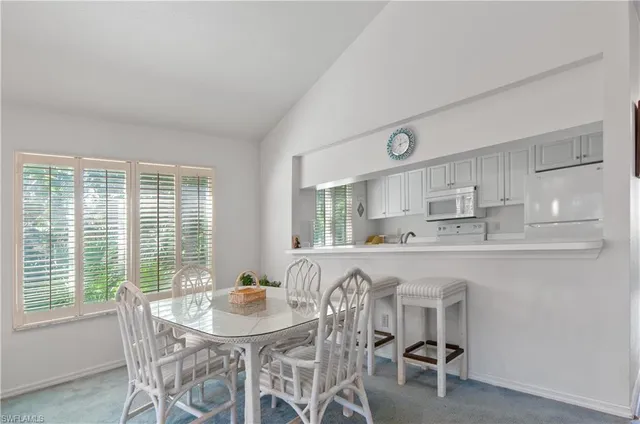 a kitchen with stainless steel appliances granite countertop a sink and a wooden cabinets