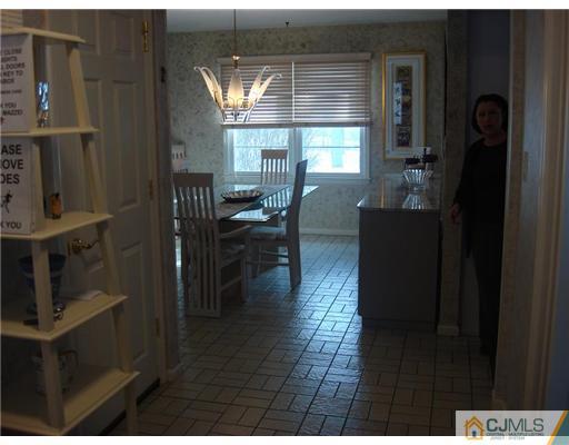 16 Fishel Road Edison, NJ 08820 - Photo 13 of 25 a dining room with furniture and a window