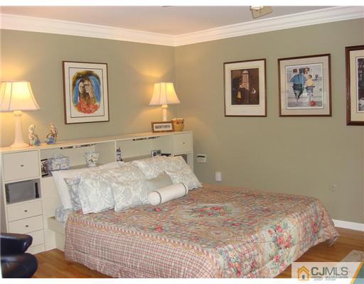16 Fishel Road Edison, NJ 08820 - Photo 14 of 25 a bedroom with a bed and painting on the wall
