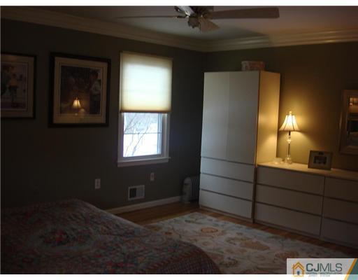 16 Fishel Road Edison, NJ 08820 - Photo 15 of 25 a room that has a window in it