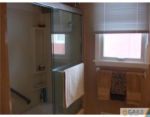 16 Fishel Road Edison, NJ 08820 - Photo 22 of 25 a bathroom with a window