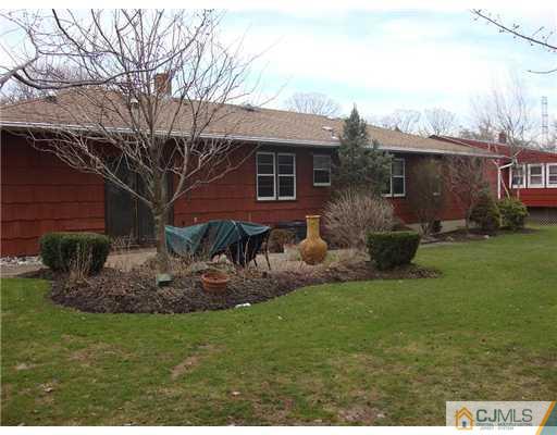 16 Fishel Road Edison, NJ 08820 - Photo 23 of 25 a view of a house with a yard and sitting area