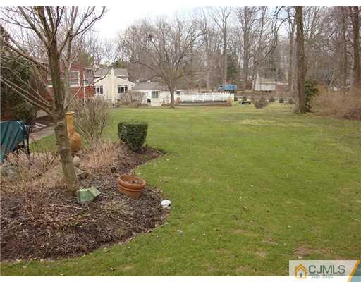 16 Fishel Road Edison, NJ 08820 - Photo 24 of 25 a view of a yard with large trees