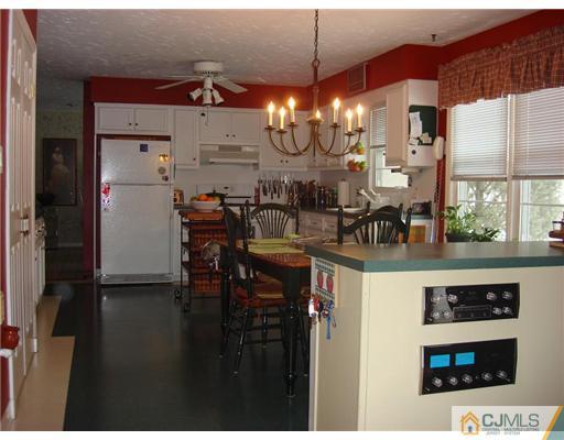 16 Fishel Road Edison, NJ 08820 - Photo 4 of 25 a view of a dining room with furniture and chandelier