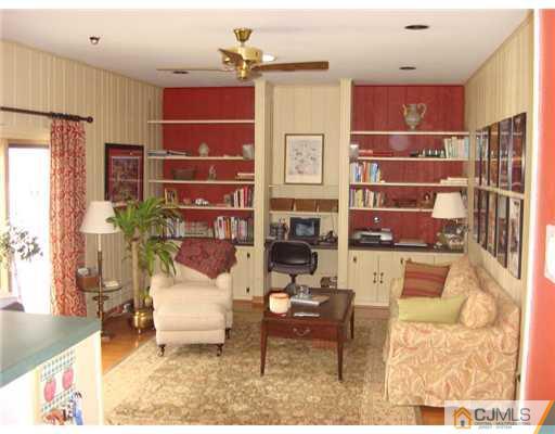 16 Fishel Road Edison, NJ 08820 - Photo 6 of 25 a living room with furniture a chandelier and a window