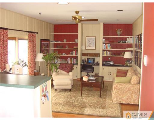 16 Fishel Road Edison, NJ 08820 - Photo 7 of 25 a living room with furniture and a fireplace
