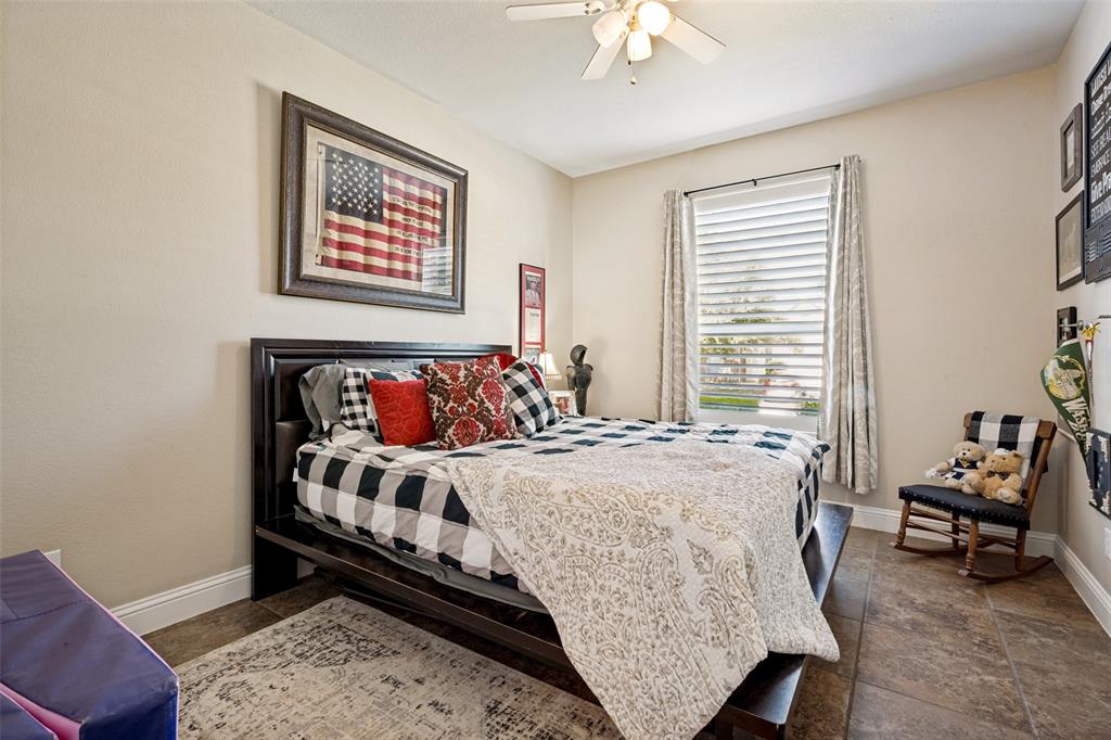 3105 Union Lake Road Denton, TX 76210 - Photo 13 of 27 Spacious room featuring neutral-toned walls, a ceiling fan with integrated lighting, a window with horizontal blinds, and tile flooring
