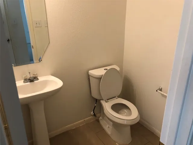 a bathroom with a sink and mirror