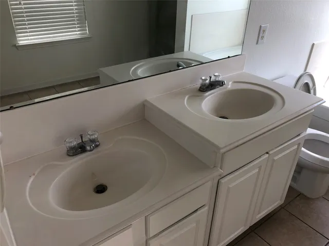 a bathroom with a glass shower door