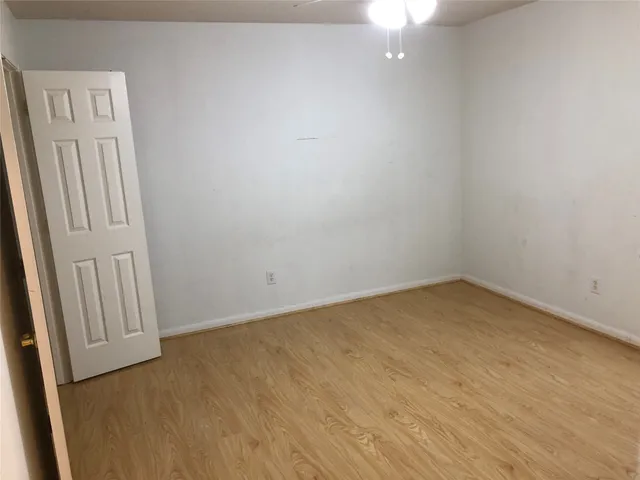 an empty room with closet area
