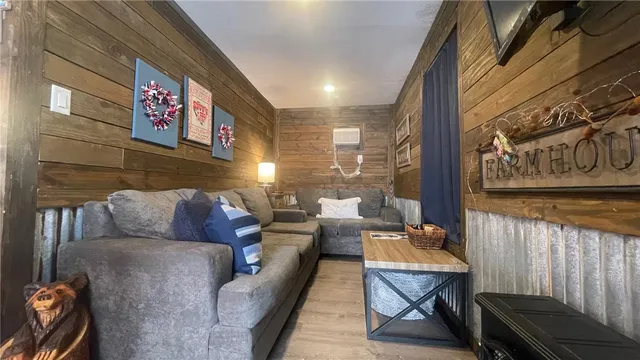 a view of a hallway view with wooden floor and staircase