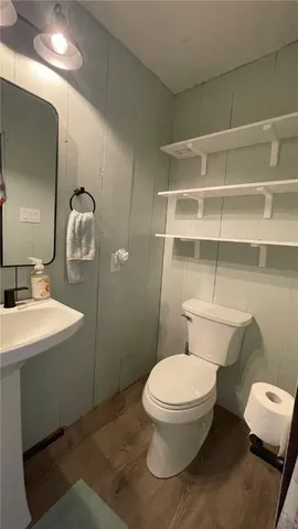 a kitchen with stainless steel appliances granite countertop a sink stove and wooden floor