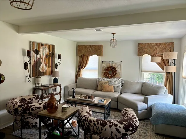 a living room with furniture and a table