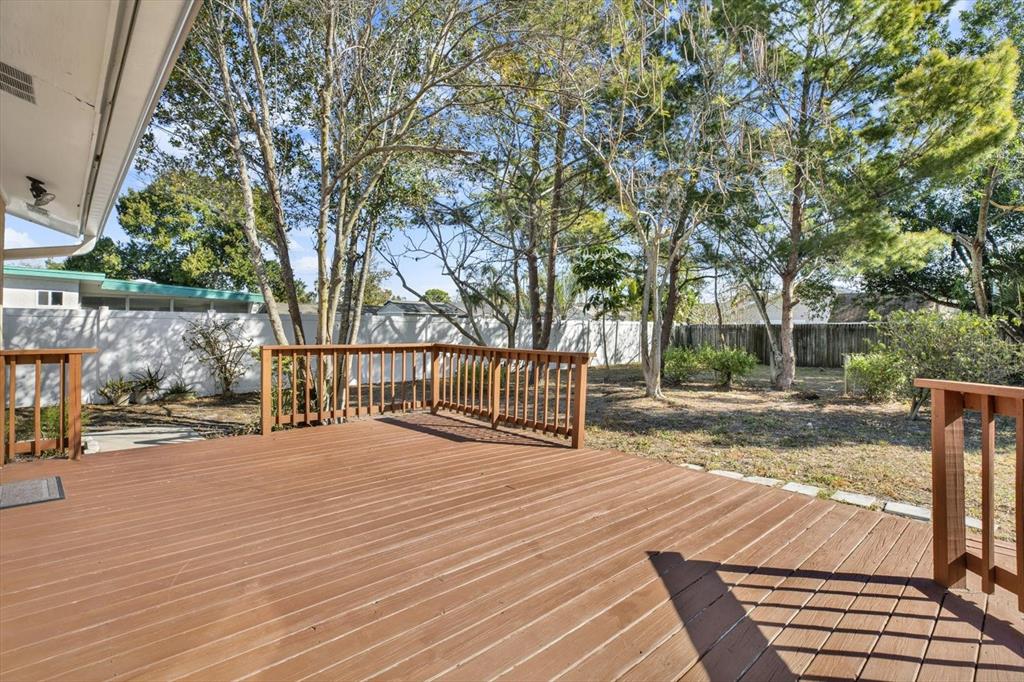 3485 Pine Street Dunedin, FL 34698 - Photo 11 of 22 a view of a deck with a trees