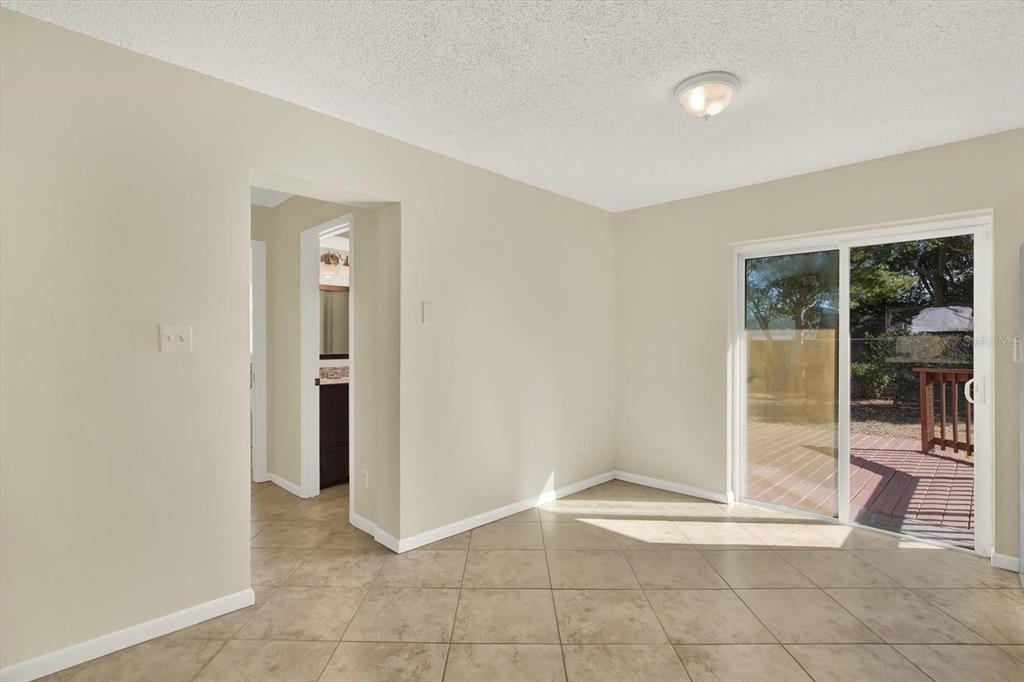 3485 Pine Street Dunedin, FL 34698 - Photo 4 of 22 a view of an empty room and glass door