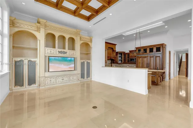 a kitchen with stainless steel appliances granite countertop a sink a stove and a refrigerator