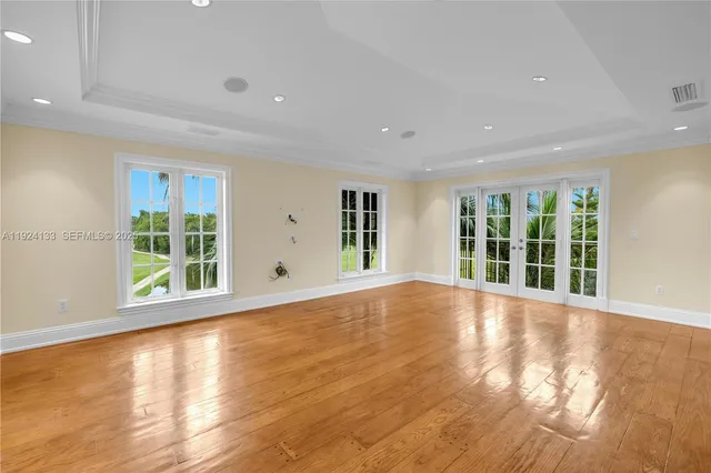a view of a bathroom with sink mirror and window