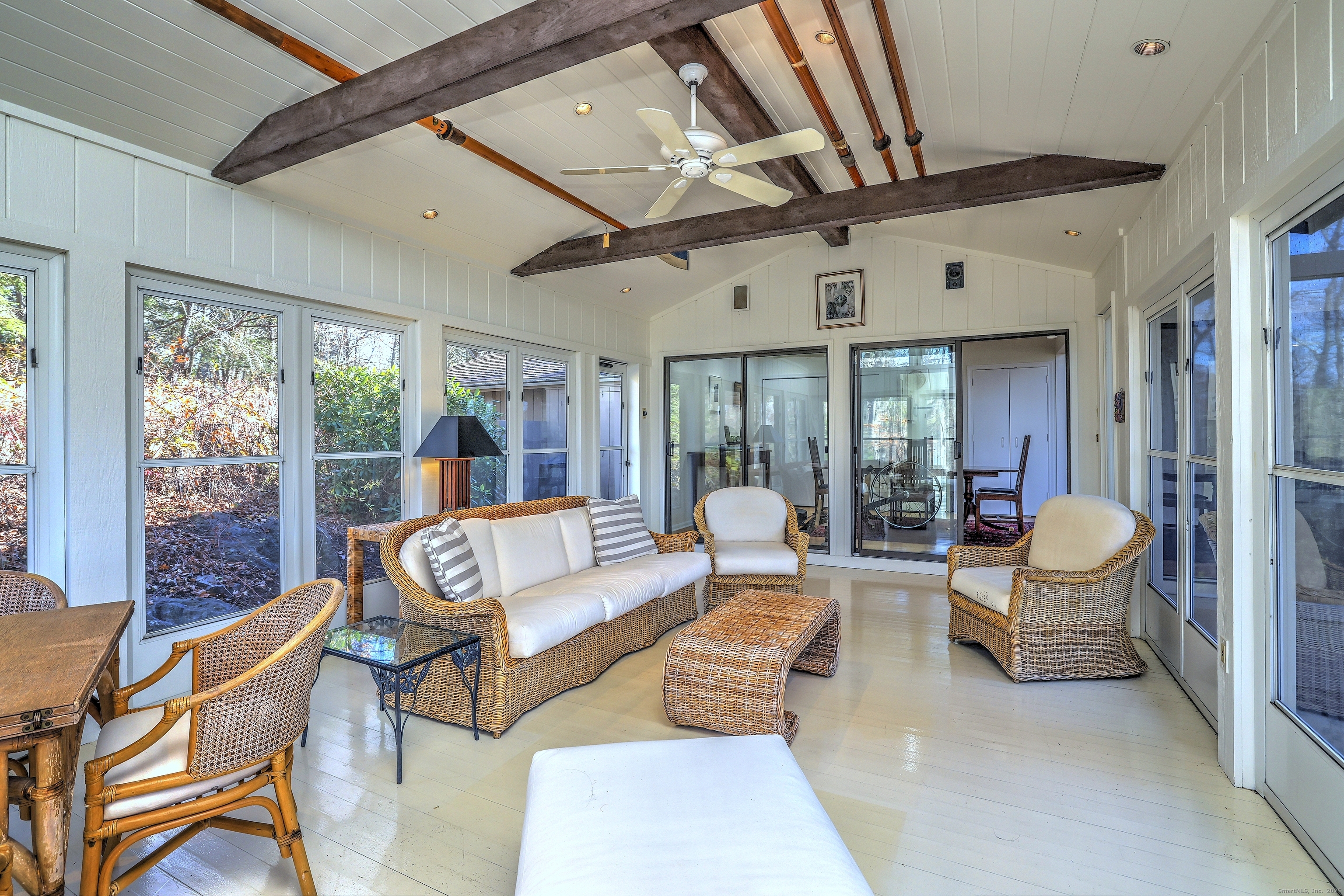 70 Woodfield Road Woodbridge, CT 06525 - Photo 12 of 37 a living room with patio furniture and a large window