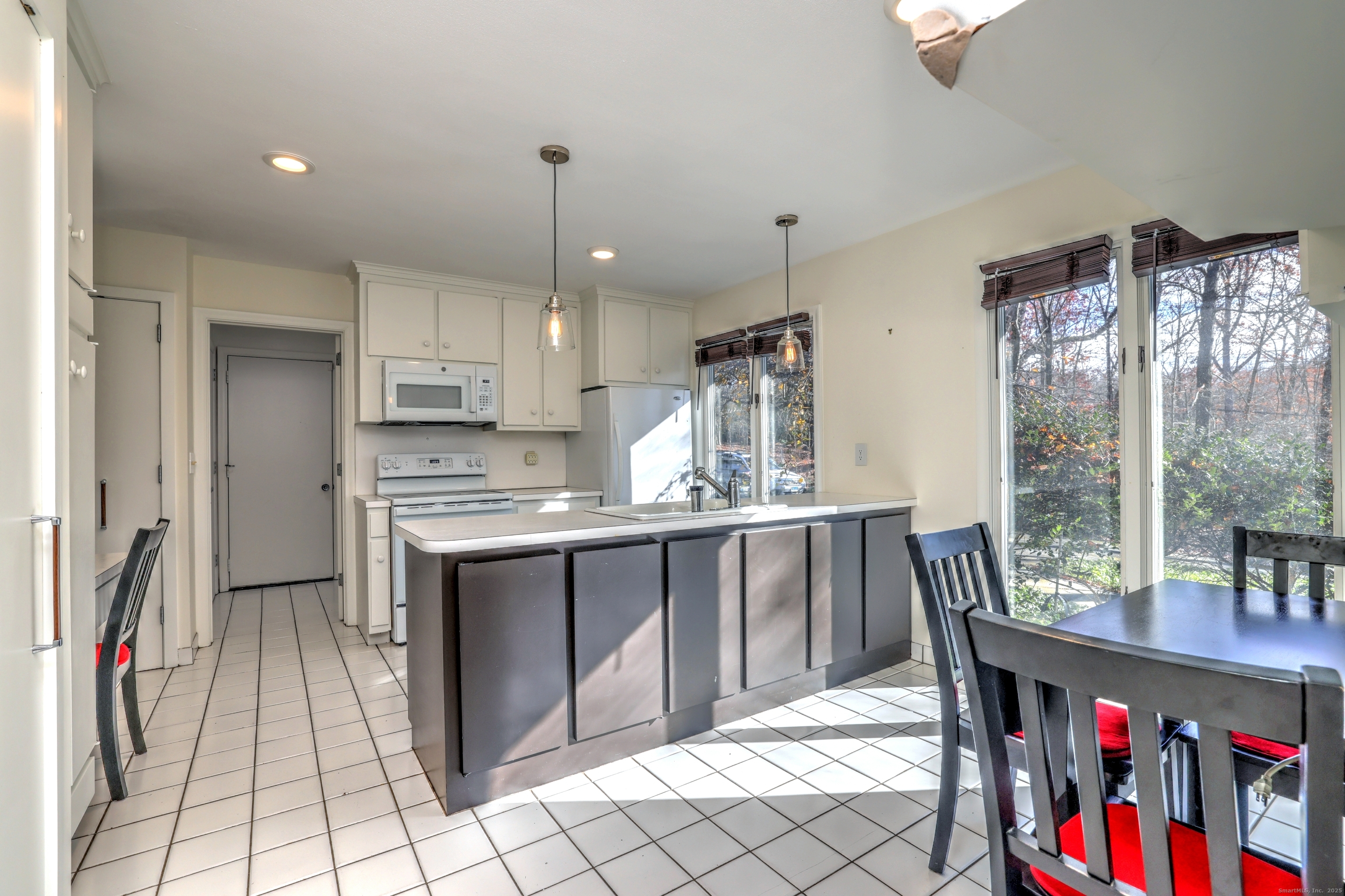 70 Woodfield Road Woodbridge, CT 06525 - Photo 13 of 37 a kitchen with stainless steel appliances granite countertop a stove top oven a sink dishwasher and cabinets