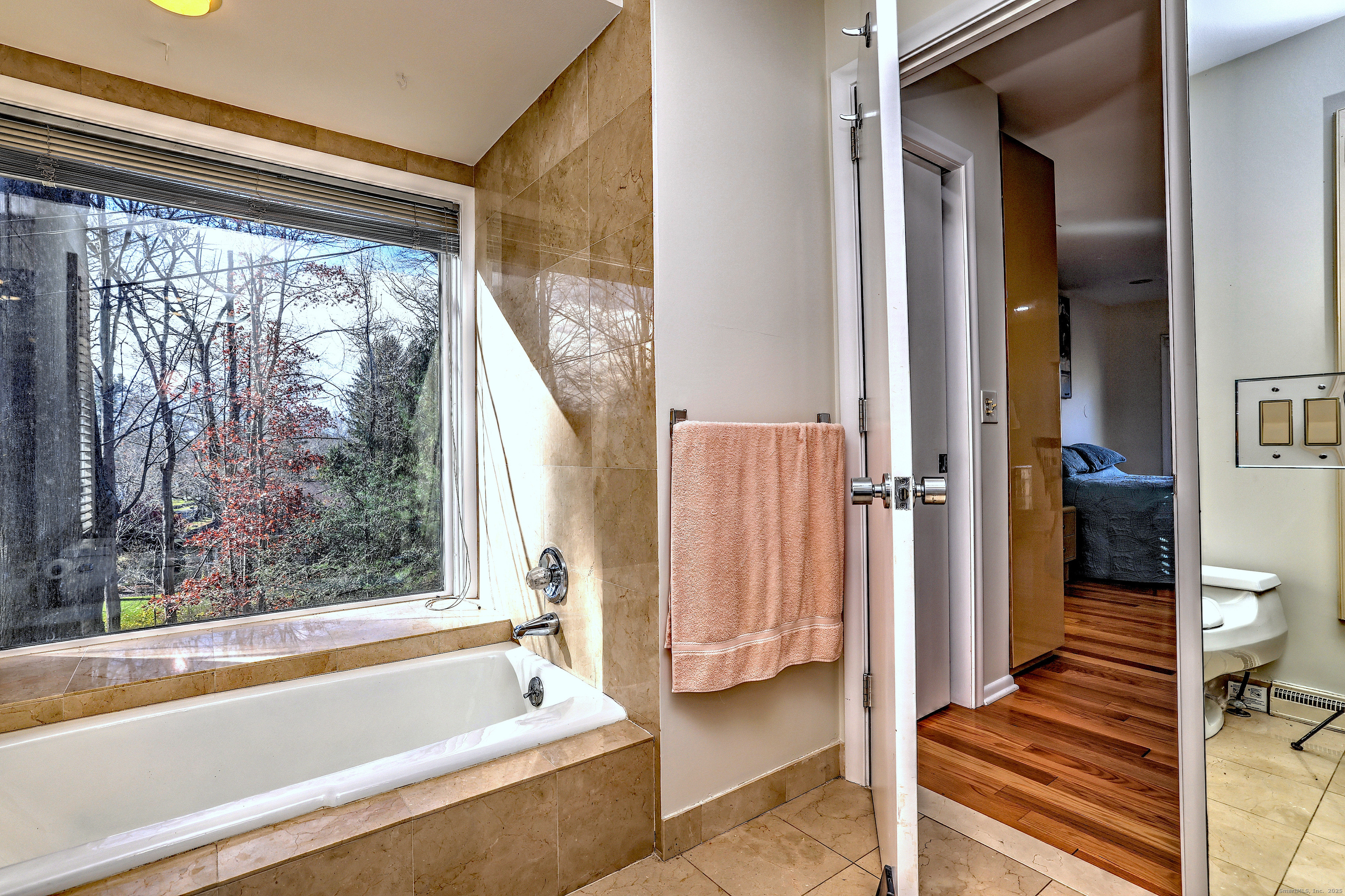 70 Woodfield Road Woodbridge, CT 06525 - Photo 23 of 37 a bathroom with a bathtub and a shower