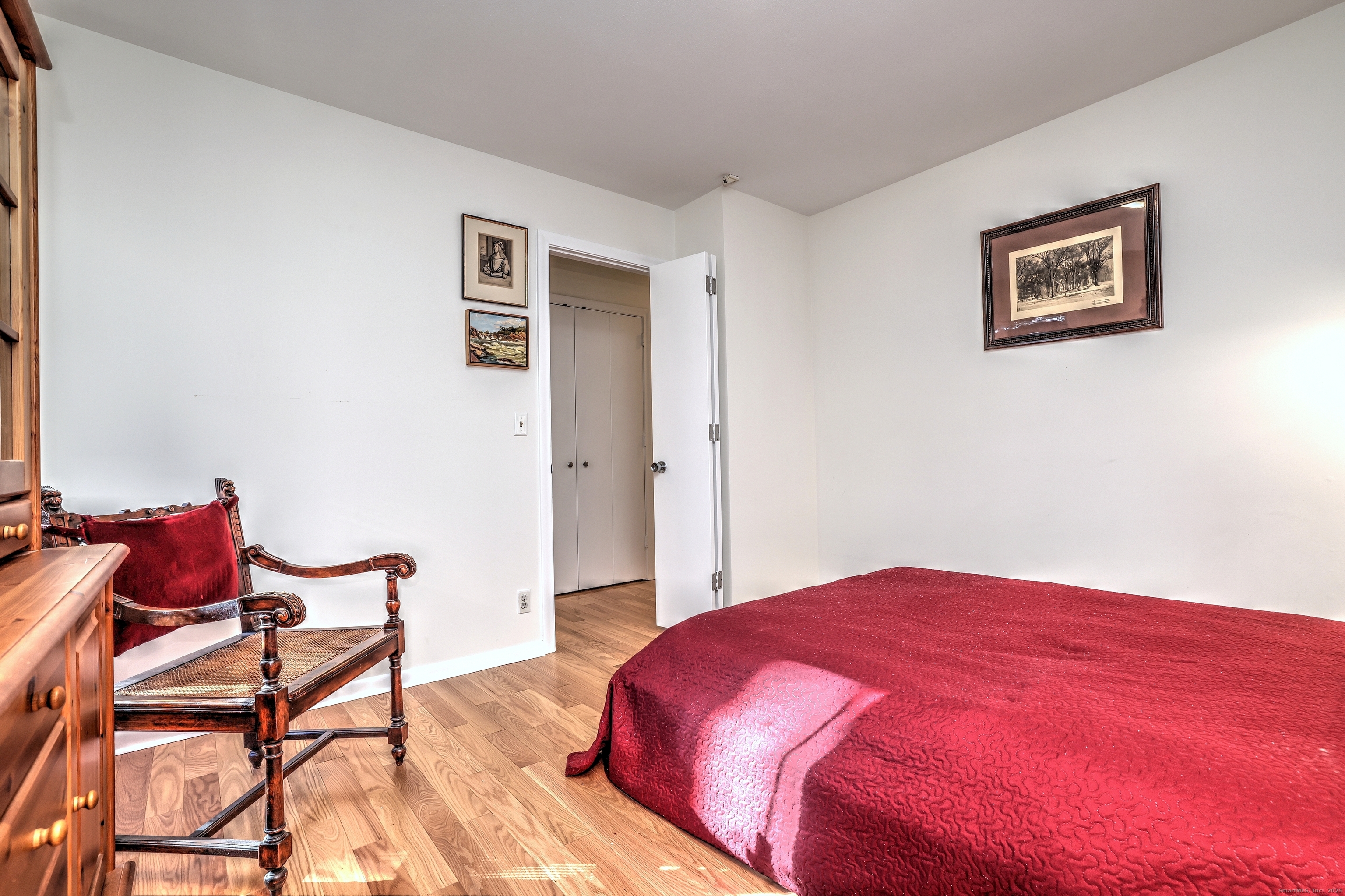 70 Woodfield Road Woodbridge, CT 06525 - Photo 26 of 37 a bedroom with a bed and chair