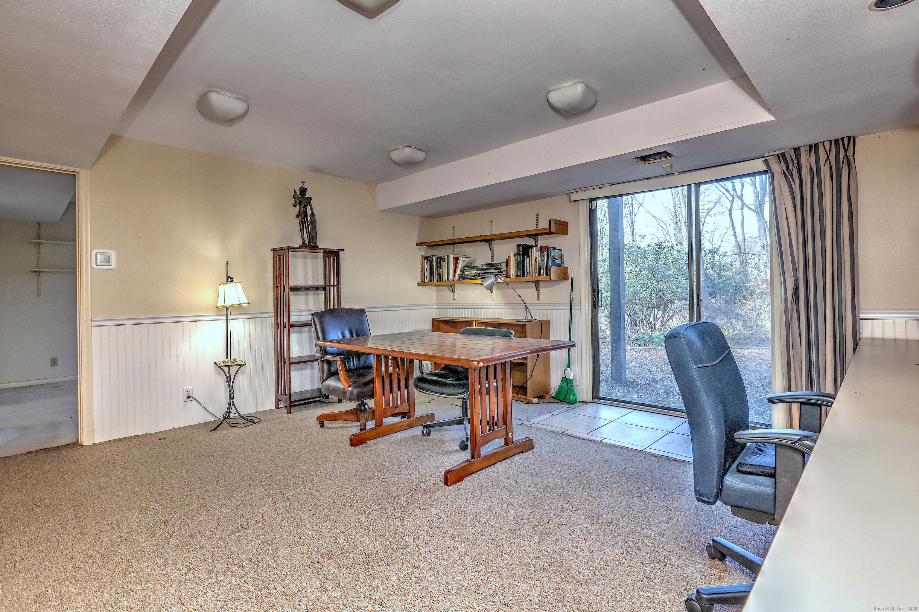 70 Woodfield Road Woodbridge, CT 06525 - Photo 29 of 37 a view of a workspace with furniture and a window