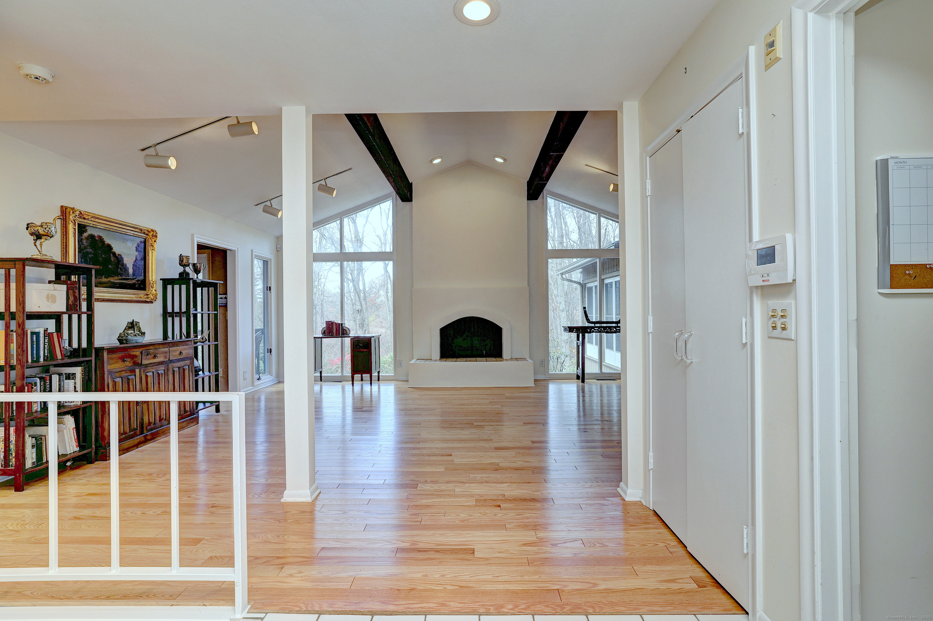 70 Woodfield Road Woodbridge, CT 06525 - Photo 3 of 37 a view of living room with wooden floor and fireplace